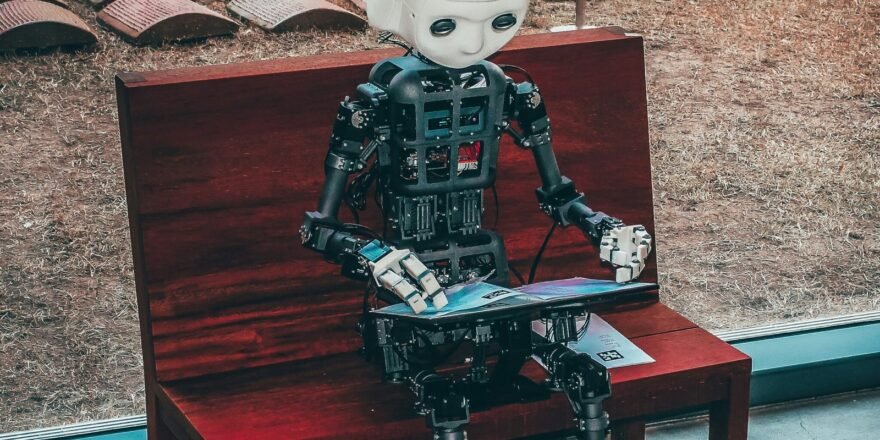 black and white robot toy on red wooden table